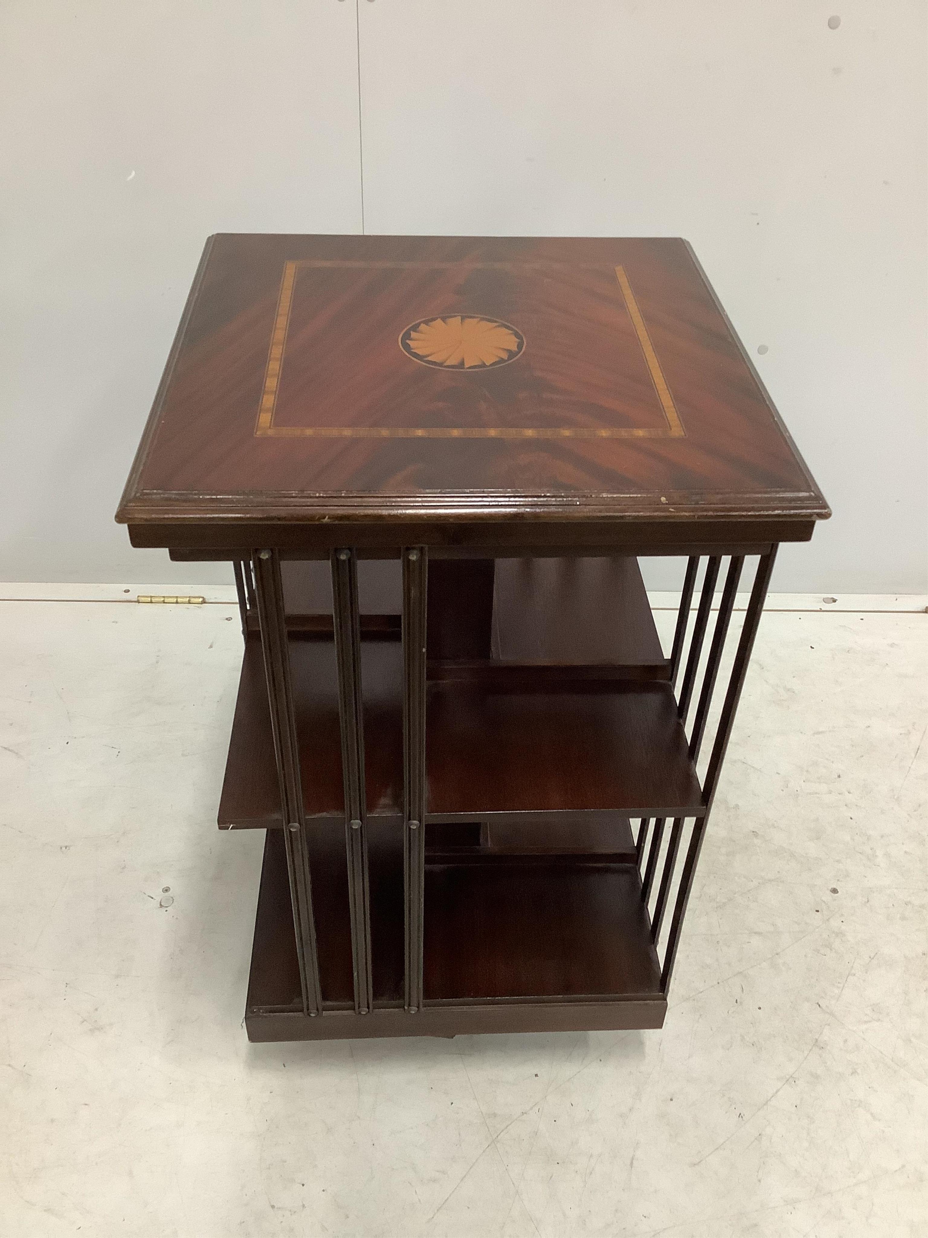 An Edwardian style inlaid mahogany revolving bookcase, width 48cm, depth 48cm, height 79cm. Condition - fair